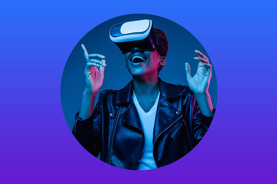 An individual wearing a VR headset is shown in a moment of excitement, illuminated in vibrant neon blue light.