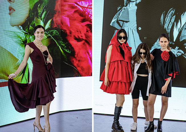 Des mannequins présentent des tenues éclectiques, avec une robe bordeaux et des ensembles avant-gardistes rouge et noir, contrastant avec un art numérique éclatant.
