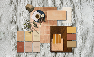 An assortment of material samples for interior design, including tiles, wood, and fabric swatches in a harmonious color scheme.