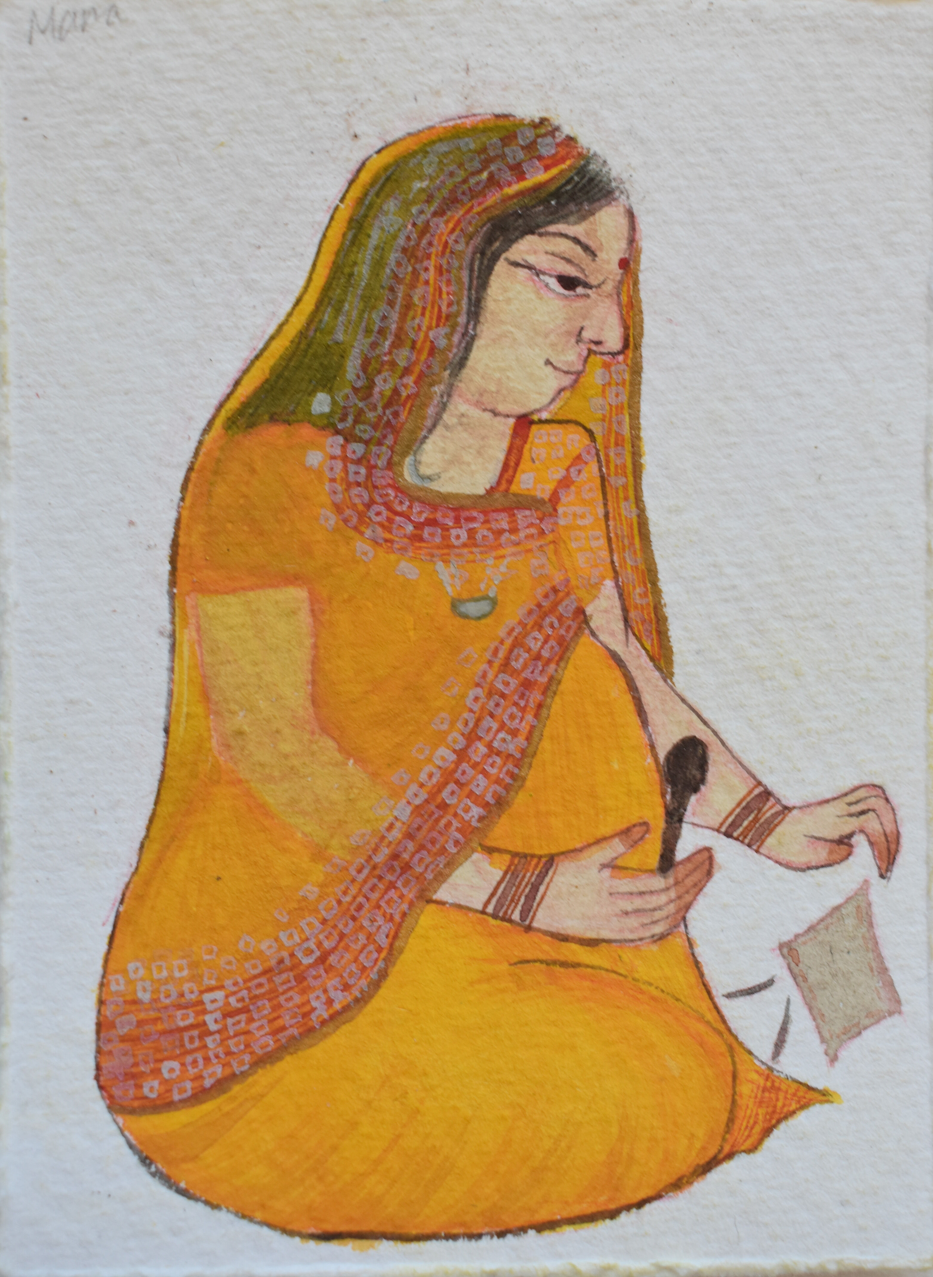 A serene portrait of an Indian woman in orange attire practicing the art of miniature painting.
