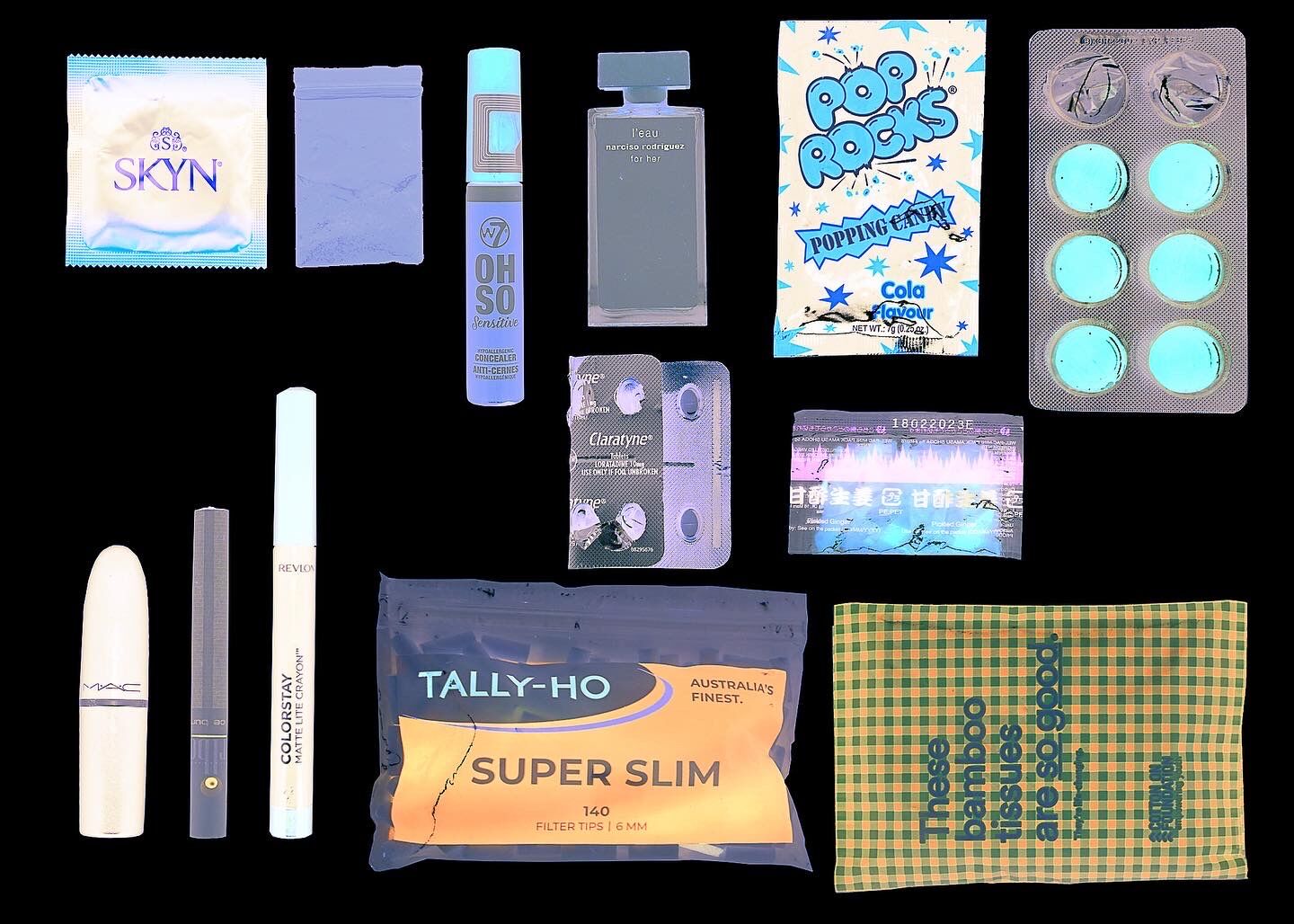 A collection of items including contraceptives, makeup, medication, candy, and rolling paper filters, displayed on a black background.