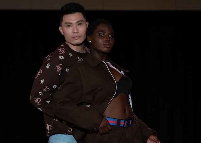 A male and female model pose confidently, showcasing a mix of casual elegance with patterned attire.

