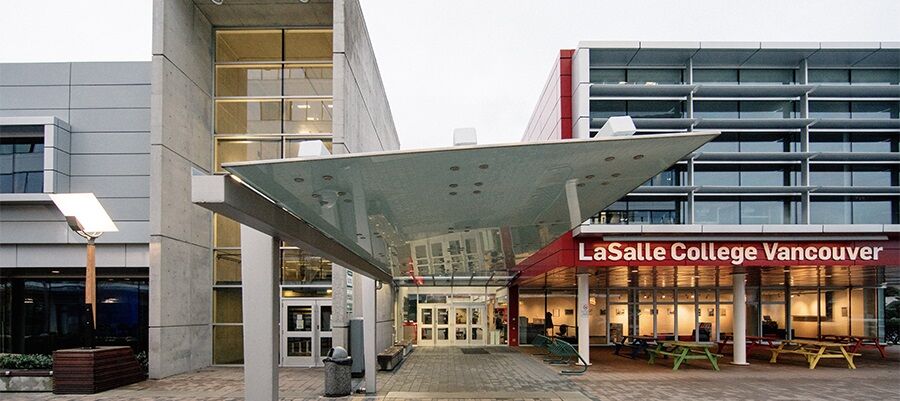 Modern entrance of LaSalle College in Vancouver with a distinctive canopy and illuminated signage.